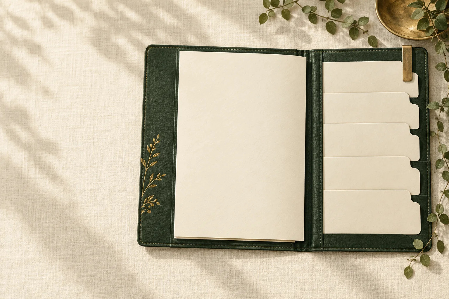 An open green folio with five paper dividers for comparing options